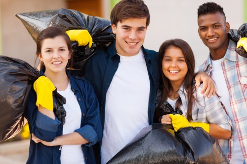 Professional cleaners sorting items for clearance